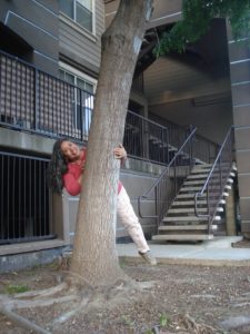 Haydee with the tree in her apartment complex